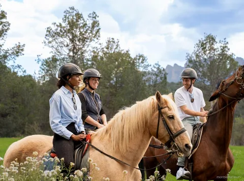 Rider on horseback along a mountain trail in Montserrat National Park
